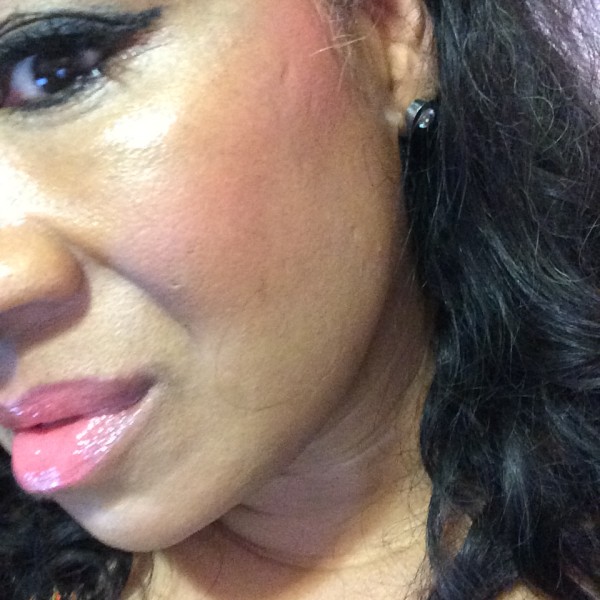 Milani Rose Powder Blush in Coral Cove swatch on brown skin