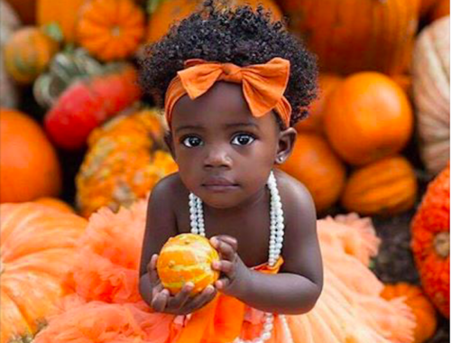 national pumpkin day beautiful little black girl and pumpkins