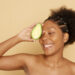 black woman with avocado national avocado day